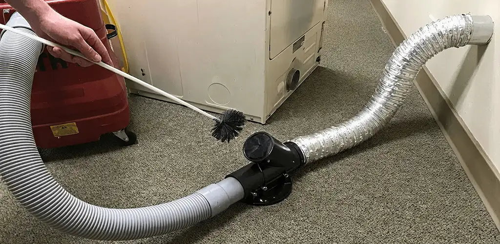 Dryer vent cleaning service removing lint from a dryer duct connection in Stockton, CA