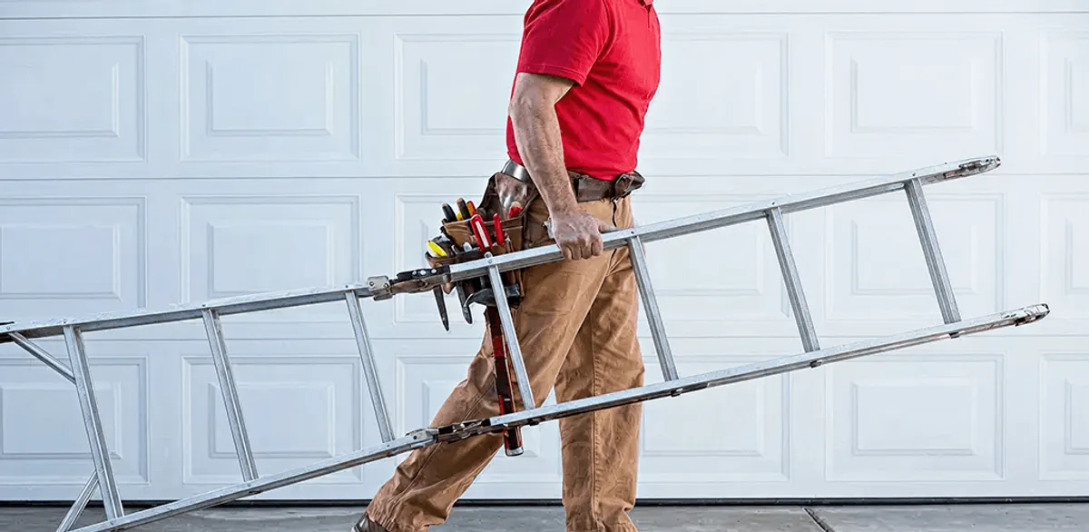Garage door repair technician arriving with tools and ladder in Stockton, CA